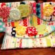 Clutch di patchwork, con fiori applicati